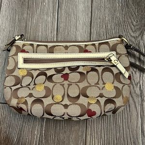 Lightly worn coach crossbody with hearts